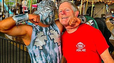 At Oaks Amusement Park, while scouting locations for their exhibition at the upcoming Multnomah County Fair, “Big Tsuky” – founder of “Portland Lucha Libre” – gave an impromptu “wrestling lesson” to Friends of the Multnomah County Fair President Larry Smith.