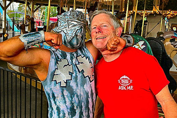 At Oaks Amusement Park, while scouting locations for their exhibition at the upcoming Multnomah County Fair, “Big Tsuky” – founder of “Portland Lucha Libre” – gave an impromptu “wrestling lesson” to Friends of the Multnomah County Fair President Larry Smith.